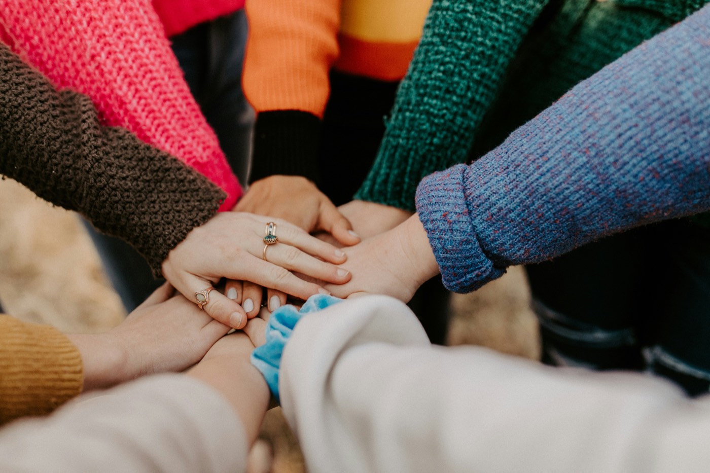 Hands of a team stacked together